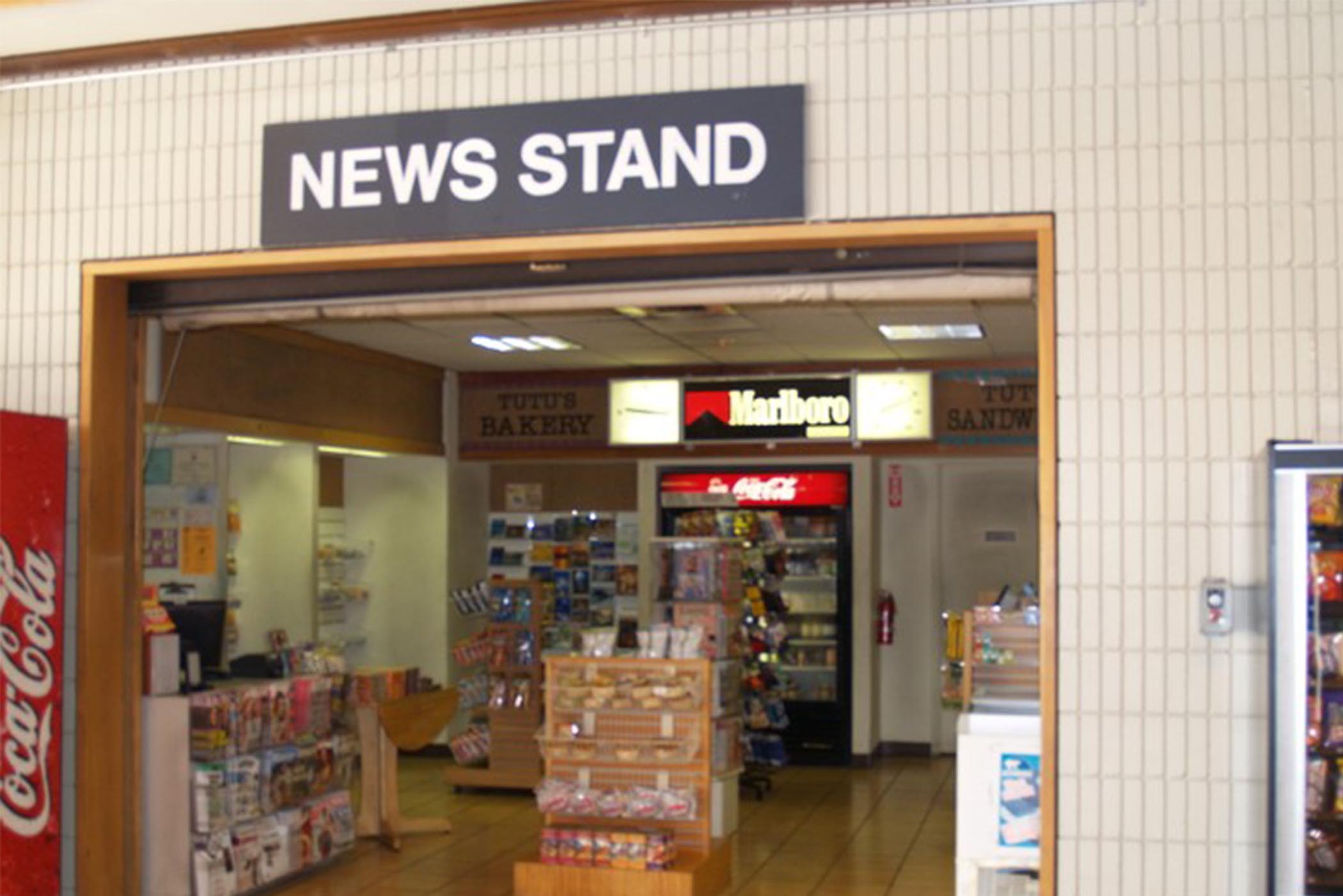 Newsstand Newspapers, magazines, books, calendars, post cards, candy, snacks, cold drinks.