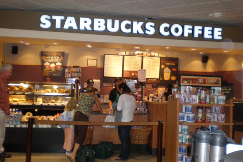 Starbucks Coffee Gates 56 & 60  More Than Coffee. Starbucks also offers a selection of premium teas, fine pastries and other delectable treats to please the taste buds.  Open daily 4:30 a.m. – 6:30 p.m.