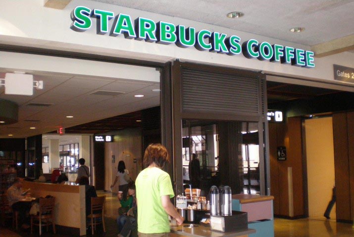 Starbucks Coffee Gate 27  Offers espresso based drinks, brewed coffees and Frappuccinos in addition to a a variety of fresh pastries, sandwiches and salads.  Open Monday-Friday 6 a.m.-3 p.m., Saturday and Sunday, 6 a.m.-4:30 p.m.