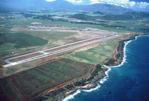 Aerial view of Lihue's east shore including a view of one of Lihue Airport's runway